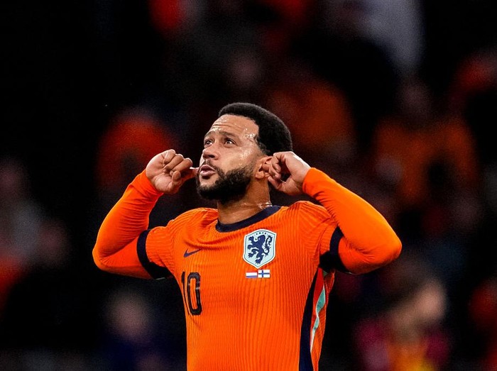 AMSTERDAM, NETHERLANDS - OCTOBER 12: Memphis Depay of Netherlands celebrates after scoring his team's third goal during the FIFA World Cup 2026 qualifier match between Netherlands and Finland at Johan Cruijff Arena on October 12, 2025 in Amsterdam, Netherlands. (Photo by Rene Nijhuis/MB Media/Getty Images)
