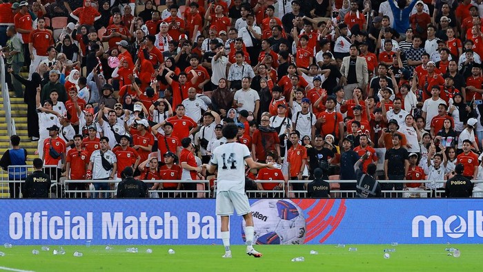 Soccer Football - FIFA World Cup - AFC Qualifiers - Group B - Iraq v Indonesia - King Abdullah Sport City, Jeddah, Saudi Arabia - October 11, 2025 Iraqs Zidane Iqbal reacts as Indonesia fans in the stands look dejected REUTERS/Stringer