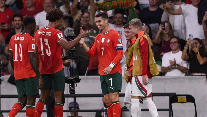 LISBON, PORTUGAL - OCTOBER 14: Cristiano Ronaldo of Portugal (C) scores the teams second goal and celebrates with teammates during the FIFA World Cup 2026 qualifier match between Portugal and Hungary at Estádio José Alvalade on October 14, 2025 in Lisbon, Portugal. (Photo by Miguel Lemos/Eurasia Sport Images/Getty Images)