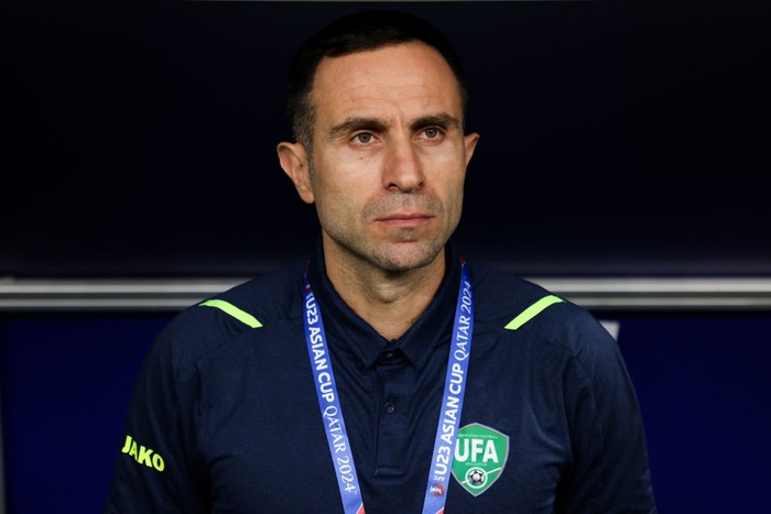AL WAKRAH, QATAR - APRIL 20: Kapadze Timur coach of Uzbekistan looks on during the AFC U23 Asian Cup Group D match between Kuwait and Uzbekistan at Al Janoub Stadium on April 20, 2024 in Al Wakrah, Qatar.  (Photo by Zhizhao Wu/Getty Images)