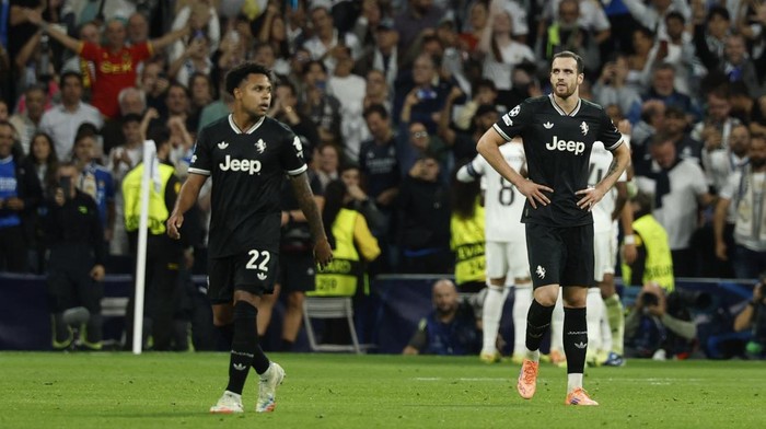 Soccer Football - UEFA Champions League - Real Madrid v Juventus - Santiago Bernabeu, Madrid, Spain - October 22, 2025 Juventus Federico Gatti looks dejected after Real Madrids Jude Bellingham scores their first goal REUTERS/Susana Vera