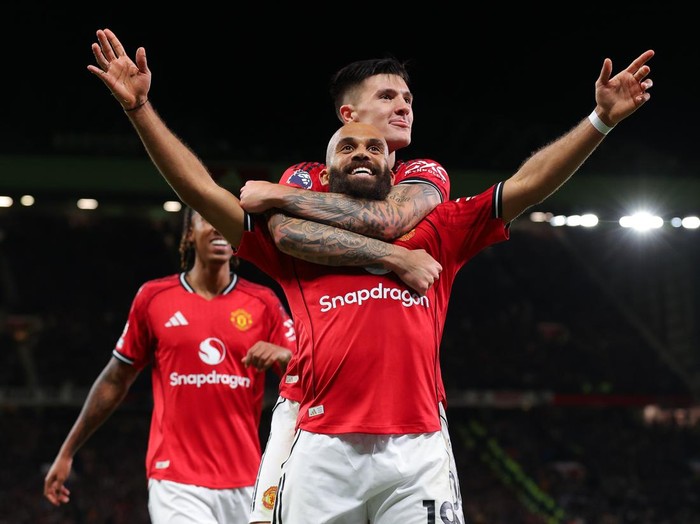 MANCHESTER, ENGLAND - OCTOBER 25: Bryan Mbeumo of Manchester United celebrates after scoring their side's third goal during the Premier League match between Manchester United and Brighton & Hove Albion at Old Trafford on October 25, 2025 in Manchester, England. (Photo by James Gill - Danehouse/Getty Images)