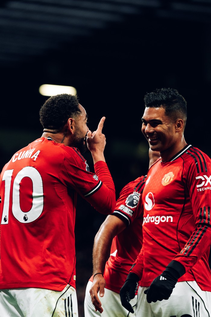 MANCHESTER, ENGLAND - OCTOBER 25: Matheus Cunha of Manchester United celebrates scoring their first goal during the Premier League match between Manchester United and Brighton & Hove Albion at Old Trafford on October 25, 2025 in Manchester, England. (Photo by Zohaib Alam - MUFC/Manchester United via Getty Images)