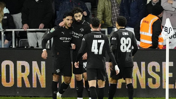 Manchester Citys Omar Marmoush (left) celebrates with team-mates after scoring their sides second goal during the Carabao Cup fourth round match at Swansea.com Stadium, Swansea. Picture date: Wednesday October 29, 2025. (Photo by Nick Potts/PA Images via Getty Images)