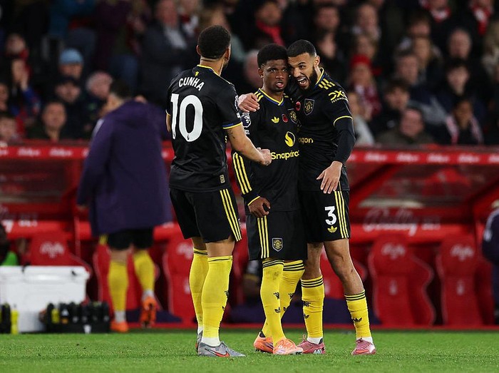 NOTTINGHAM, ENGLAND - NOVEMBER 01: Amad Diallo of Manchester United celebrates scoring his teams second goal with teammates Noussair Mazraoui and Matheus Cunha during the Premier League match between Nottingham Forest and Manchester United at City Ground on November 01, 2025 in Nottingham, England. (Photo by Michael Regan/Getty Images)