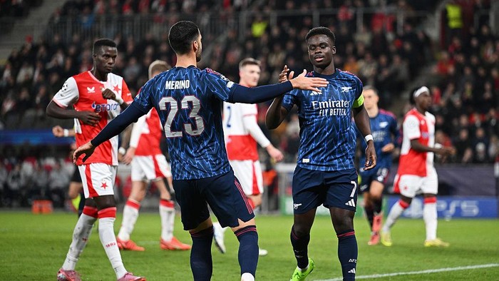 PRAGUE, CZECH REPUBLIC - NOVEMBER 04: Bukayo Saka of Arsenal celebrates scoring his teams first goal with teammate Mikel Merino (L) during the UEFA Champions League 2025/26 League Phase MD4 match between SK Slavia Praha and Arsenal FC at Eden Arena on November 04, 2025 in Prague, Czech Republic. (Photo by David Price/Arsenal FC via Getty Images)