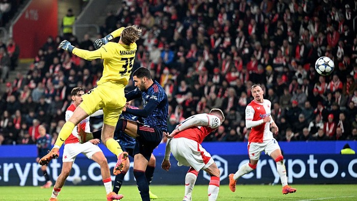 PRAGUE, CZECH REPUBLIC - NOVEMBER 04: Mikel Merino of Arsenal scores his teams third goal past Jakub Markovic of Slavia Praha during the UEFA Champions League 2025/26 League Phase MD4 match between SK Slavia Praha and Arsenal FC at Eden Arena on November 04, 2025 in Prague, Czech Republic. (Photo by Stuart MacFarlane/Arsenal FC via Getty Images)