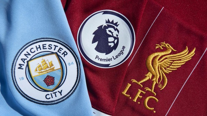 MANCHESTER, ENGLAND - MAY 14: The Premier League logo with the Manchester City and Liverpool club badges on their first team home shirts on May 14, 2020 in Manchester, England. (Photo by Visionhaus)