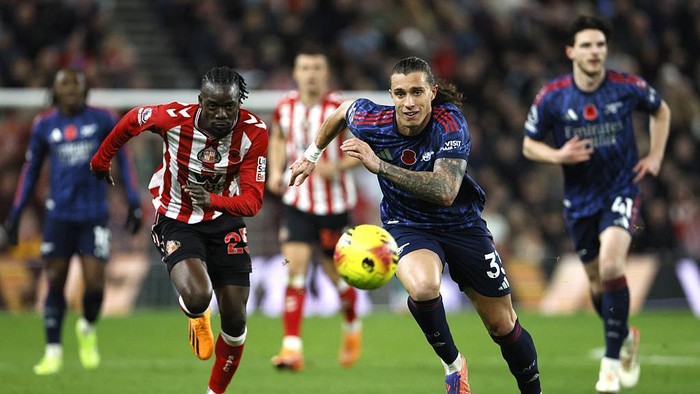 Sunderlands Bertrand Traore (left) and Arsenals Riccardo Calafiori battle for the ball during the Premier League match at the Stadium of Light, Sunderland. Picture date: Saturday November 8, 2025. (Photo by Richard Sellers/PA Images via Getty Images)