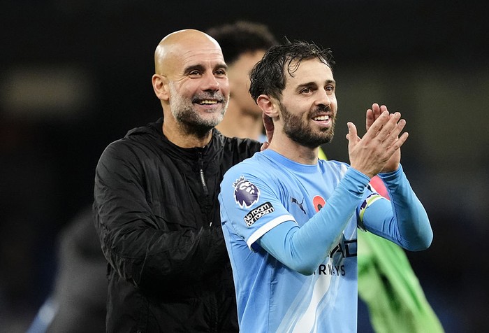 Manchester City's Bernardo Silva (right) and manager Pep Guardiola applaud the fans following victory in the Premier League match at Etihad Stadium, Manchester. Picture date: Sunday November 9, 2025. (Photo by Nick Potts/PA Images via Getty Images)