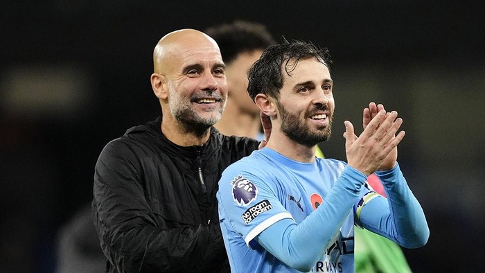 Manchester Citys Bernardo Silva (right) and manager Pep Guardiola applaud the fans following victory in the Premier League match at Etihad Stadium, Manchester. Picture date: Sunday November 9, 2025. (Photo by Nick Potts/PA Images via Getty Images)