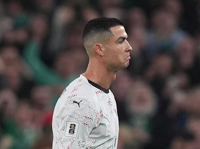 Portugal's Cristiano Ronaldo hands the arm band to team-mate Bernardo Silva after being shown a red card during the 2026 FIFA World Cup European Qualifying, Group F match at the Aviva Stadium in Dublin, Ireland. Picture date: Thursday November 13, 2025. (Photo by Niall Carson/PA Images via Getty Images)