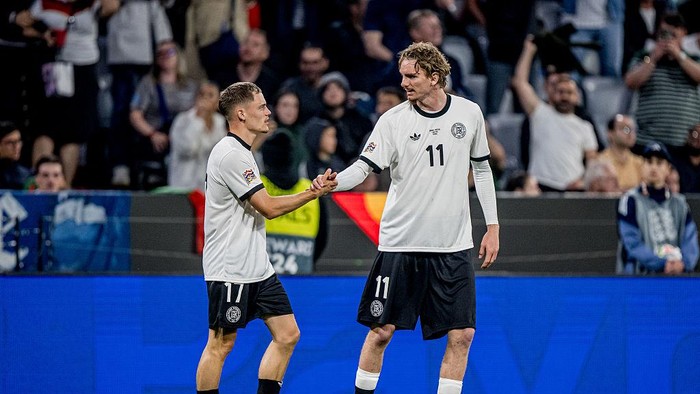 MUNICH, GERMANY - JUNE 04: Florian Wirtz (L) of Germany celebrates after scoring his teams first goal with Nick Woltemade during the UEFA Nations League 2025 semifinal match between Germany and Portugal at Munich Football Arena on June 04, 2025 in Munich, Germany. (Photo by Markus Gilliar - GES Sportfoto/Getty Images)