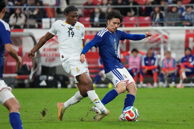 2246702878 TOYOTA, JAPAN - NOVEMBER 14: Francis Abu of Ghana breaks his leg as he is kicked by Ao Tanaka of Japan during the international friendly match between Japan and Ghana at Toyota Stadium on November 14, 2025 in Toyota, Aichi, Japan. (Photo by Etsuo Hara/Getty Images)