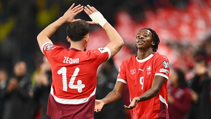 GENEVA, SWITZERLAND - NOVEMBER 15: Johan Manzambi of Switzerland celebrates scoring his teams fourth goal with teammate Andi Zeqiri during the FIFA World Cup 2026 qualifier match between Switzerland and Sweden at Stade de Geneve on November 15, 2025 in Geneva, Switzerland. (Photo by Mattia Ozbot/Getty Images)