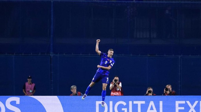 Croatia's forward #09 Andrej Kramaric celebrates scoring a goal during the FIFA World Cup 2026 Group L European qualification football match between Croatia and Montenegro at the Maksimir Stadium in Zagreb, on September 8, 2025. (Photo by DAMIR SENCAR / AFP)