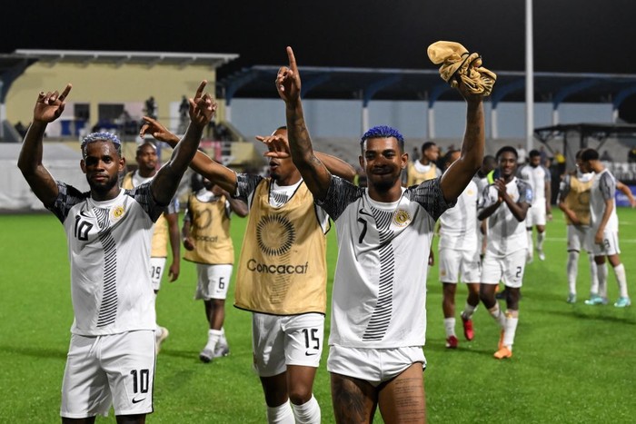 ORANJESTAD - (l-r) Leandro Bacuna of Curacao, Shannon Carmelia of Curacao, Juninho Bacuna of Curacao celebrate the victory during the World Cup qualifying Concacaf match between Aruba v Curacao at the Compleho Deportivo Guillermo Trinidad stadium on June 8, 2024 (local time) in Oranjestad, Aruba. ANP | Hollandse Hoogte | GERRIT VAN COLOGNE (Photo by ANP via Getty Images)