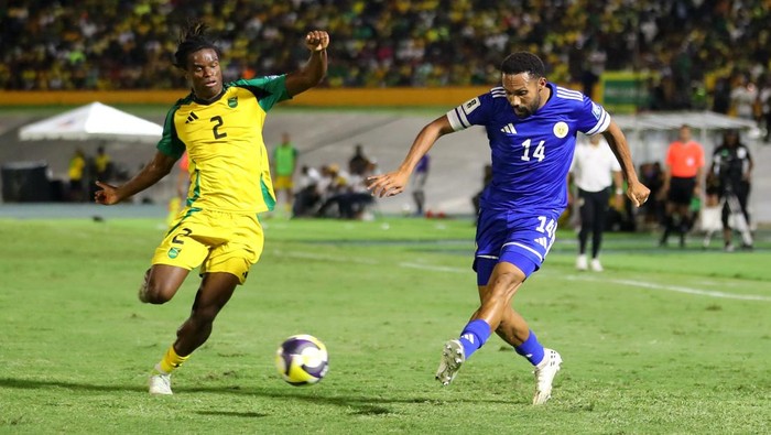 Soccer Football - FIFA World Cup - CONCACAF Qualifiers - Group B - Jamaica v Curacao - National Stadium Independence Park, Kingston, Jamaica - November 18, 2025 Curacao players celebrate after they qualify for the World Cup REUTERS/Gilbert Bellamy