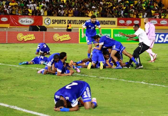 Soccer Football - FIFA World Cup - CONCACAF Qualifiers - Group B - Jamaica v Curacao - National Stadium Independence Park, Kingston, Jamaica - November 18, 2025 Curacao players celebrate after they qualify for the World Cup REUTERS/Gilbert Bellamy