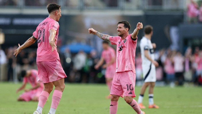 Dec 6, 2025; Fort Lauderdale, Florida, USA; Inter Miami forward Tadeo Allende (21) and forward Lionel Messi (10) celebrate after winning the 2025 MLS Cup against the Vancouver Whitecaps FC at Chase Stadium. Mandatory Credit: Nathan Ray Seebeck-Imagn Images