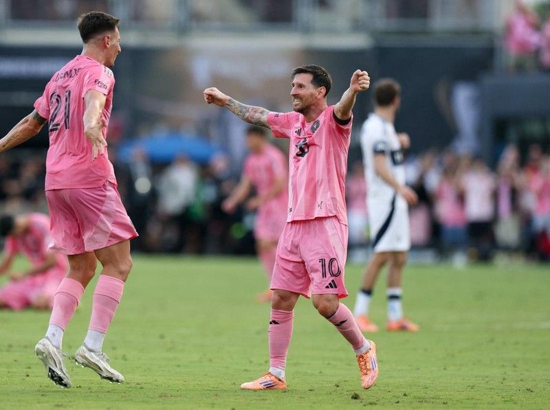 Dec 6, 2025; Fort Lauderdale, Florida, USA; Inter Miami forward Tadeo Allende (21) and forward Lionel Messi (10) celebrate after winning the 2025 MLS Cup against the Vancouver Whitecaps FC at Chase Stadium. Mandatory Credit: Nathan Ray Seebeck-Imagn Images