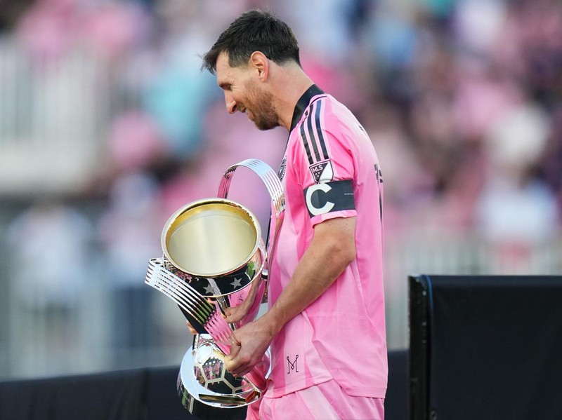 FORT LAUDERDALE, FLORIDA - DECEMBER 06: Lionel Messi #10 of Inter Miami CF holds the Champion's trophy after the Audi 2025 MLS Cup Final match between Inter Miami CF and Vancouver Whitecaps FC at Chase Stadium on December 06, 2025 in Fort Lauderdale, Florida. (Photo by Rich Storry/Getty Images)