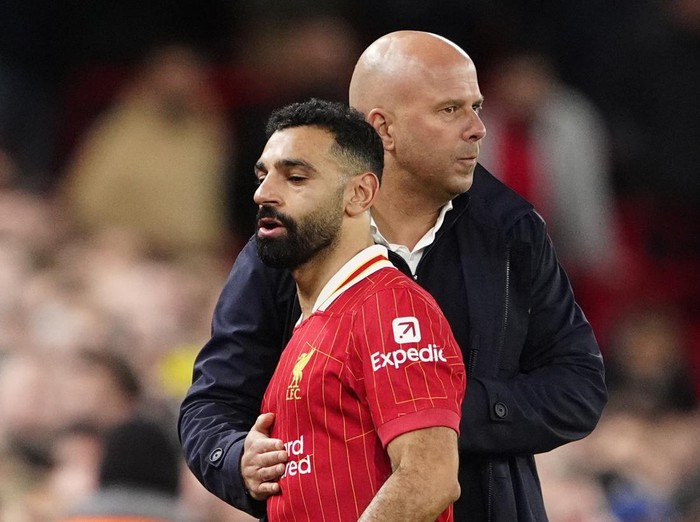 Liverpool manager Arne Slot speaks with Mohamed Salah during the Premier League match at Anfield, Liverpool. Picture date: Sunday December 1, 2024. (Photo by Peter Byrne/PA Images via Getty Images)