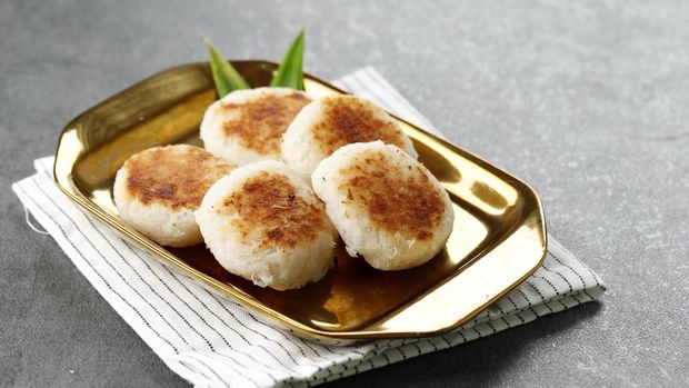 Round Wingko Babat, Traditional Indonesian Snack Made from Glutinous Rice Flour, Sugar, and Grated Young Coconut. Copy Space for Text