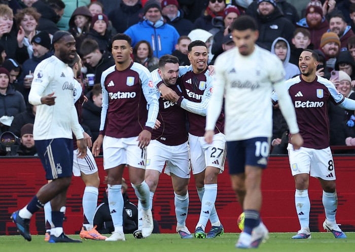 Soccer Football - Premier League - Aston Villa v Nottingham Forest - Villa Park, Birmingham, Britain - January 3, 2026 Aston Villa's John McGinn celebrates scoring their second goal with Morgan Rogers and Youri Tielemans Action Images via Reuters/Andrew Boyers EDITORIAL USE ONLY. NO USE WITH UNAUTHORIZED AUDIO, VIDEO, DATA, FIXTURE LISTS, CLUB/LEAGUE LOGOS OR 'LIVE' SERVICES. ONLINE IN-MATCH USE LIMITED TO 120 IMAGES, NO VIDEO EMULATION. NO USE IN BETTING, GAMES OR SINGLE CLUB/LEAGUE/PLAYER PUBLICATIONS. PLEASE CONTACT YOUR ACCOUNT REPRESENTATIVE FOR FURTHER DETAILS..