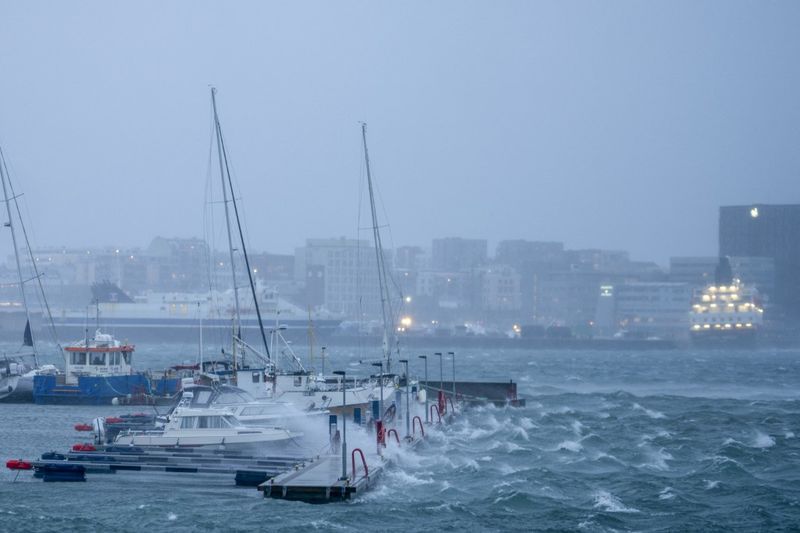 Boats are seen during heavy winds in the harbour of Bodo, Norway on February 1, 2024. (Photo by Per-Inge Johnsen / NTB / AFP) / Norway OUT