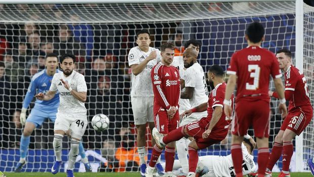 Soccer Football - UEFA Champions League - Liverpool v Qarabag - Anfield, Liverpool, Britain - January 28, 2026 Liverpool's Mohamed Salah scores their third goal from a free kick Action Images via Reuters/Jason Cairnduff
