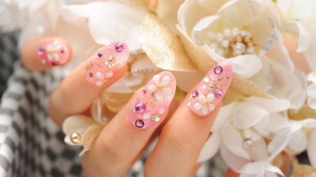 Beautiful woman hand with design of finger nail