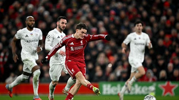 Liverpool's German midfielder #07 Florian Wirtz scores the team's second goal during the UEFA Champions League football match between Liverpool and Qarabag at Anfield in Liverpool, north west England on January 28, 2026. (Photo by Paul ELLIS / AFP)