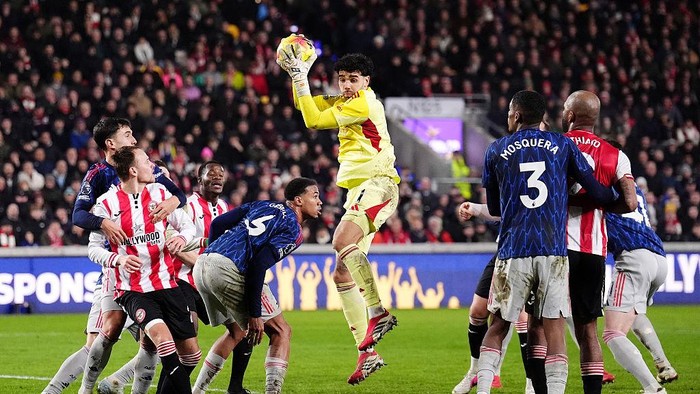 Arsenal goalkeeper David Raya (centre) claims the ball during the Premier League match at the Gtech Community Stadium, London. Picture date: Thursday February 12, 2026. (Photo by John Walton/PA Images via Getty Images)