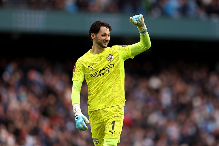 MANCHESTER, ENGLAND - FEBRUARY 14: James Trafford of Manchester City celebrates as Alfie Dorrington of Salford City (not pictured) scores an own goal, giving Manchester City their first goal during the Emirates FA Cup Fourth Round match between Manch