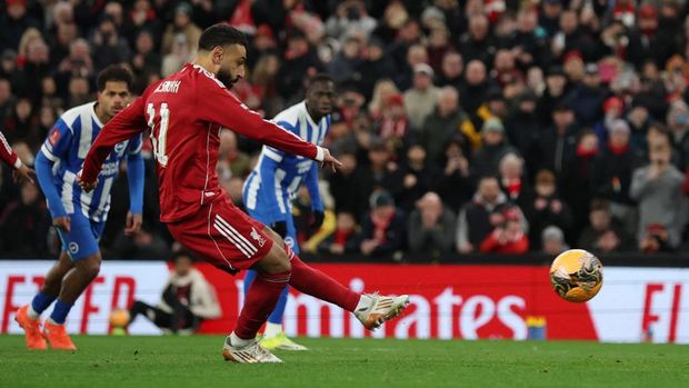 Soccer Football -  FA Cup - Fourth Round - Liverpool v Brighton & Hove Albion - Anfield, Liverpool, Britain - February 14, 2026 Liverpool's Mohamed Salah scores their third goal from the penalty spot REUTERS/Phil Noble