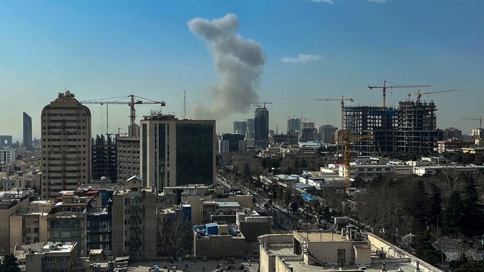 A plume of smoke rises following a reported explosion in Tehran on February 28, 2026. Israels defence ministry announced February 28 it had launched a preemptive strike on Iran as sirens sounded in Jerusalem and people across the country received 