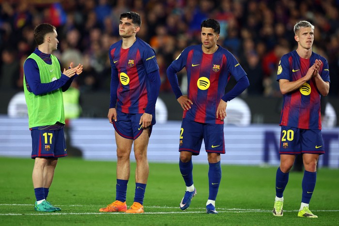 Soccer Football - Copa del Rey - Semi Final - Second Leg - FC Barcelona v Atletico Madrid - Spotify Camp Nou, Barcelona, Spain - March 3, 2026 FC Barcelonas Marc Casado, Gerard Martin, Joao Cancelo, and Dani Olmo look dejected after the match REUTER