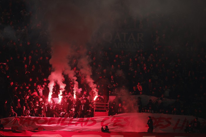 Soccer Football - Ligue 1 - Paris St Germain v Olympique de Marseille - Parc des Princes, Paris, France - February 8, 2026 Paris St Germain fans with flares and flags in the stands REUTERS/Benoit Tessier