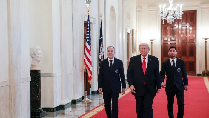U.S. President Donald Trump arrives with Inter Miami CF captain Lionel Messi on the day he honors reigning Major League Soccer (MLS) champion Inter Miami CF players and team officials with an event in the East Room of the White House in Washington, D.C., U.S., March 5, 2026. REUTERS/Jonathan Ernst