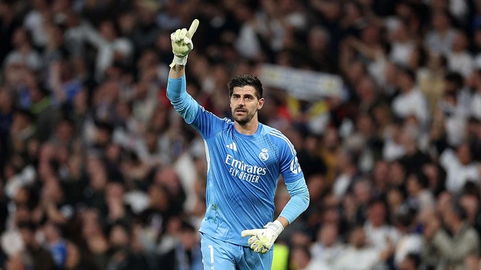 MADRID, SPAIN - MARCH 11: Thibaut Courtois of Real Madrid celebrates after their sides first goal by Federico Valverde (not pictured) during the UEFA Champions League 2025/26 Round of 16 First Leg match between Real Madrid CF and Manchester City FC a