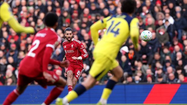 LIVERPOOL, ENGLAND - MARCH 15: Dominik Szoboszlai of Liverpool scores his team's first goal during the Premier League match between Liverpool and Tottenham Hotspur at Anfield on March 15, 2026 in Liverpool, England. (Photo by Carl Recine/Getty Images)
