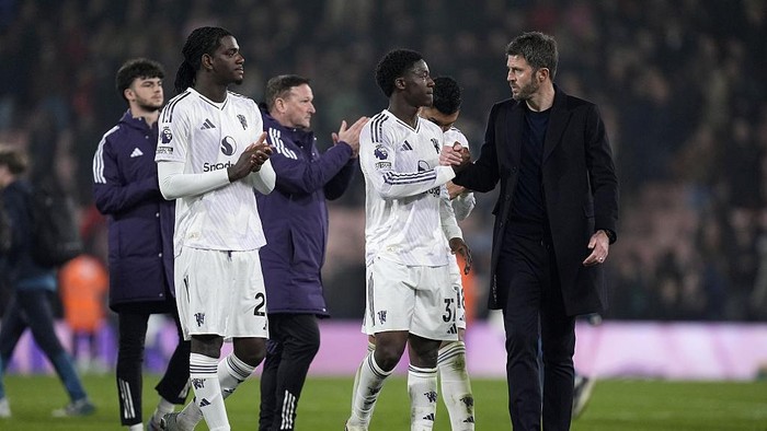 Manchester United manager Michael Carrick and Kobbie Mainoo at the final whistle after the Premier League match at the Vitality Stadium, Bournemouth. Picture date: Friday March 20, 2026. (Photo by Andrew Matthews/PA Images via Getty Images)