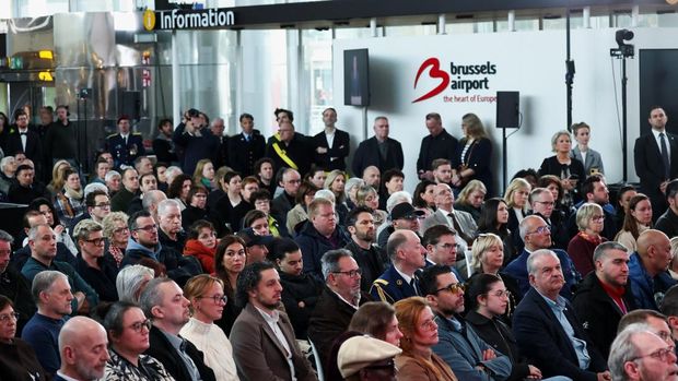 People attend the ceremony, as they take part in the commemoration of the 10th anniversary of the March 22, 2016 suicide bomb attacks at the city's international airport and the Maelbeek metro station, at Brussels Airport in Zaventem, Belgium March 22, 2026. REUTERS/Yves Herman