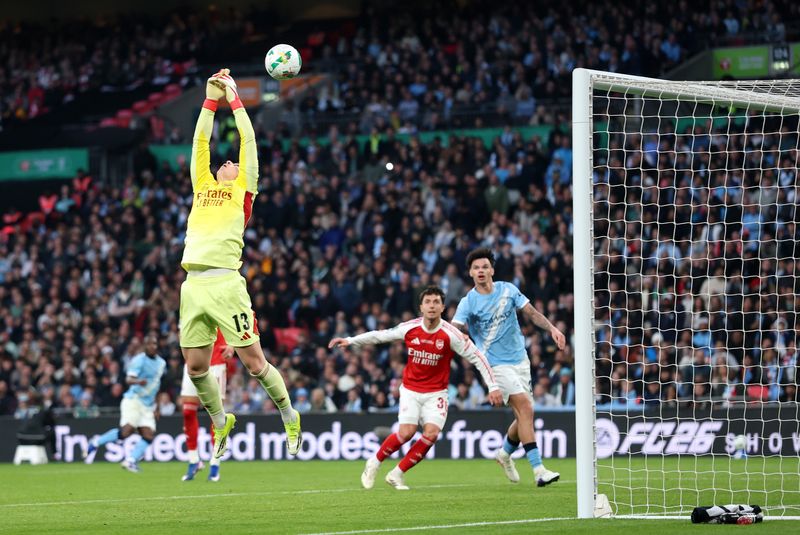 LONDON, ENGLAND - MARCH 22: Kepa Arrizabalaga of Arsenal fails to control the ball before Nico O'Reilly of Manchester City (not pictured) scores his team's first goal during the Carabao Cup Final match Arsenal and between Manchester City at Wembley Stadium on March 22, 2026 in London, England. (Photo by Julian Finney/Getty Images)