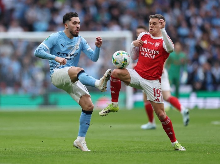 Soccer Football - Carabao Cup - Final - Arsenal v Manchester City - Wembley Stadium, London, Britain - March 22, 2026 Manchester City's Rayan Cherki in action with Arsenal's Leandro Trossard REUTERS/Toby Melville EDITORIAL USE ONLY. NO USE WITH UNAUTHORIZED AUDIO, VIDEO, DATA, FIXTURE LISTS, CLUB/LEAGUE LOGOS OR 'LIVE' SERVICES. ONLINE IN-MATCH USE LIMITED TO 120 IMAGES, NO VIDEO EMULATION. NO USE IN BETTING, GAMES OR SINGLE CLUB/LEAGUE/PLAYER PUBLICATIONS. PLEASE CONTACT YOUR ACCOUNT REPRESENTATIVE FOR FURTHER DETAILS..