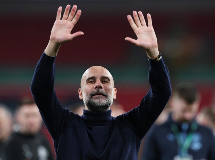 Soccer Football - Carabao Cup - Final - Arsenal v Manchester City - Wembley Stadium, London, Britain - March 22, 2026 Manchester City manager Pep Guardiola celebrates winning the Carabao Cup Action Images via Reuters/Paul Childs EDITORIAL USE ONLY. NO USE WITH UNAUTHORIZED AUDIO, VIDEO, DATA, FIXTURE LISTS, CLUB/LEAGUE LOGOS OR 'LIVE' SERVICES. ONLINE IN-MATCH USE LIMITED TO 120 IMAGES, NO VIDEO EMULATION. NO USE IN BETTING, GAMES OR SINGLE CLUB/LEAGUE/PLAYER PUBLICATIONS. PLEASE CONTACT YOUR ACCOUNT REPRESENTATIVE FOR FURTHER DETAILS..