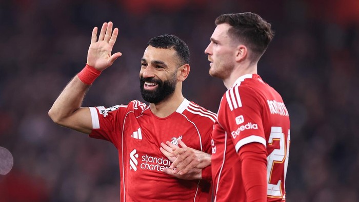 LIVERPOOL, ENGLAND - JANUARY 28: Mohamed Salah of Liverpool (L) celebrates with Andrew Robertson of Liverpool after scoring their 3rd goal during the UEFA Champions League 2025/26 League Phase MD8 match between Liverpool FC and Qarabag FK at Anfield 