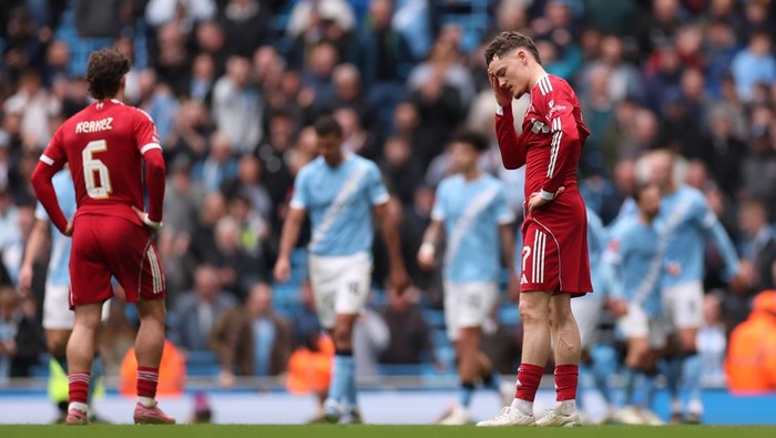MANCHESTER, ENGLAND - APRIL 04: Florian Wirtz of Liverpool looks dejected after Erling Haaland of Manchester City (not pictured) scored the teams second goal during the Emirates FA Cup Quarter Final match between Manchester City and Liverpool at Eti
