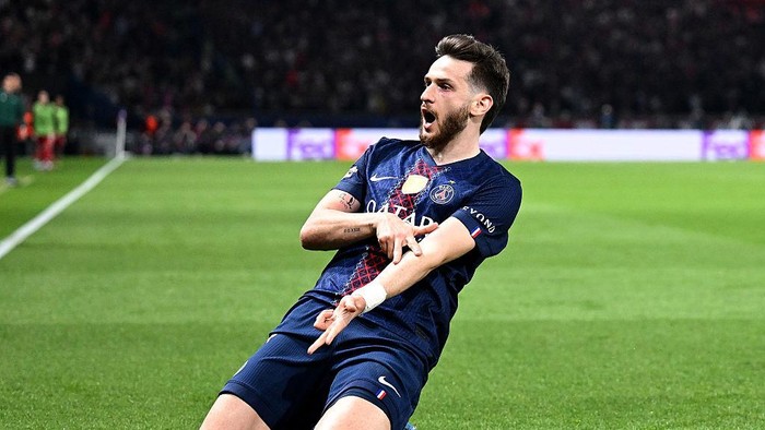 PARIS, FRANCE - APRIL 08: Khvicha Kvaratskhelia of Paris Saint-Germain celebrates scoring his teams second goal during the UEFA Champions League 2025/26 Quarter-Final First Leg match between Paris Saint-Germain FC and Liverpool FC at Parc des Prince